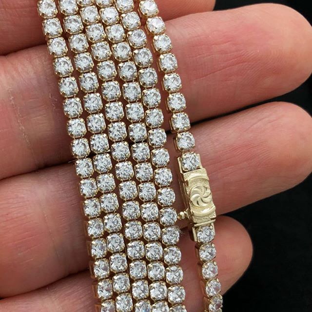 Yellow gold, baguette diamonds and high quality shine, yours today from HipHopBling.com 
